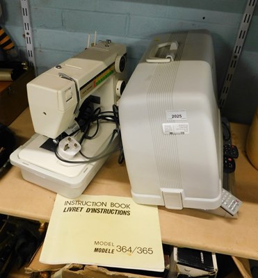 Lot 2025 - A cased model 364/365 electric sewing machine.