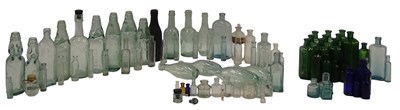 Lot 395 - A collection of glass bottles, to include...