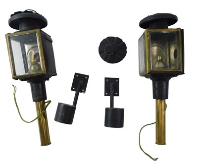 Lot 403 - Two carriage lanterns and brackets, 40cm high.