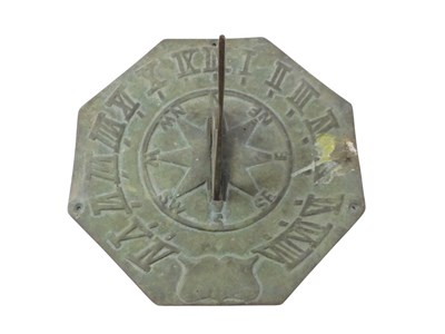 Lot 404 - A cast brass sundial, 28cm diameter. Note: VAT...