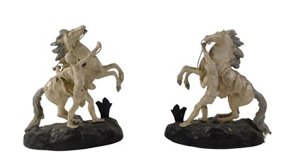Lot 371 - A pair of 20thC Spelter Marley horses, on oval...