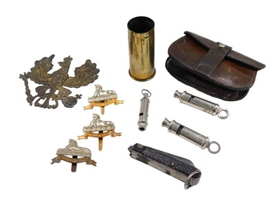 Lot 595 - Military Interest. An empty brass shell case,...