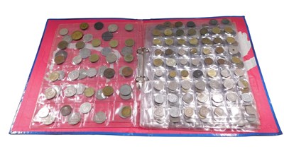 Lot 599 - An album containing mixed foreign coins.