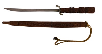 Lot 619 - A 20thC Eastern sword, with carved hardwood...
