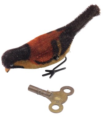 Lot 632 - An early 20thC clockwork bird, with key.