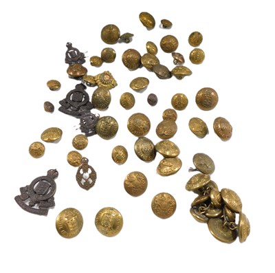 Lot 645 - A group of military buttons and cap badges.
