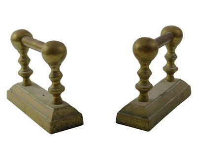 Lot 496 - A pair of brass fire dogs, 14cm high, 20cm wide.