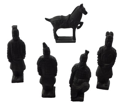 Lot 661 - Five Eastern clay figures, each painted black...