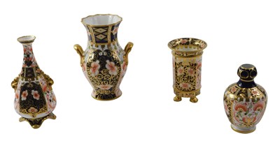 Lot 671 - Four Royal Crown Derby vases, each in the...