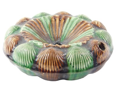 Lot 691 - A Majolica spittoon, with brown and green...