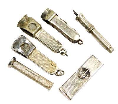 Lot 198 - Four silver cigar cutters, three with engine...
