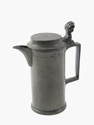 Lot 512 - A 19thC pewter lidded flagon, with a moulded...