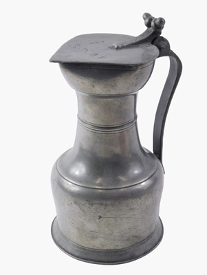 Lot 513 - A 19thC pewter lidded flagon, with moulded...