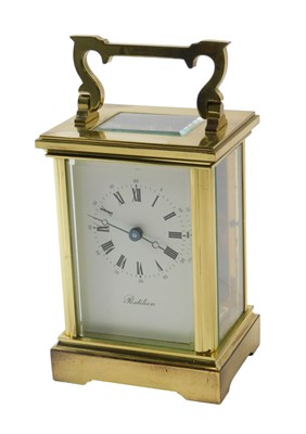 Lot 523 - A 20thC brass carriage clock, white enamel...