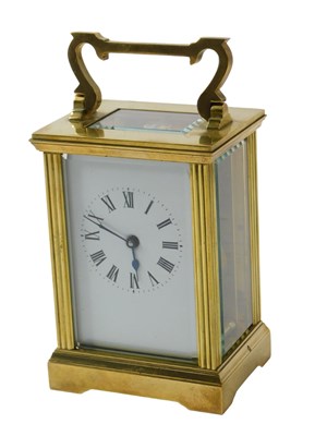 Lot 524 - A 20thC brass carriage clock, with white...