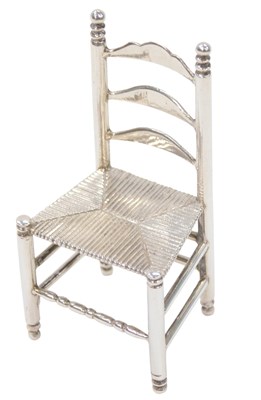 Lot 27 - A Dutch silver miniature of a ladder back...