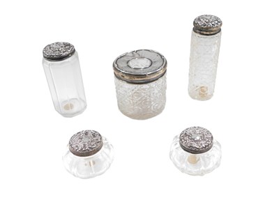 Lot 547 - Five cut glass and silver topped dressing...