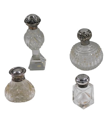 Lot 550 - Four silver topped and cut glass dressing...