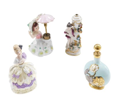 Lot 557 - Four ceramic scent bottles, comprising a...