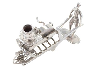 Lot 39 - A Dutch silver miniature of a knife sharpener...