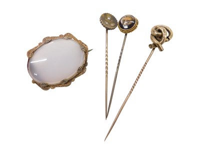 Lot 777 - Three stick pins and a brooch, to include a...