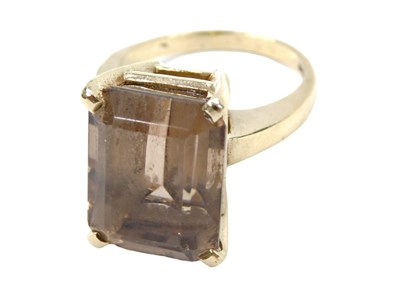 Lot 785 - A 9ct gold smokey quartz dress ring, in basket...