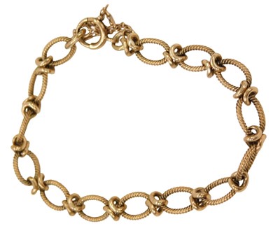 Lot 787 - A 9ct gold fancy link bracelet, with oval...