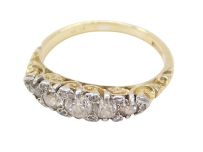 Lot 792 - A gypsy ring, set with five round brilliant...