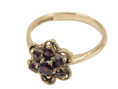 Lot 793 - A 9ct gold cluster ring, set with garnets (one...