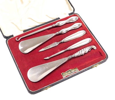 Lot 115 - A George V button hook and shoe horn with a...