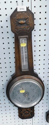 Lot 2153 - An oak aneroid barometer.