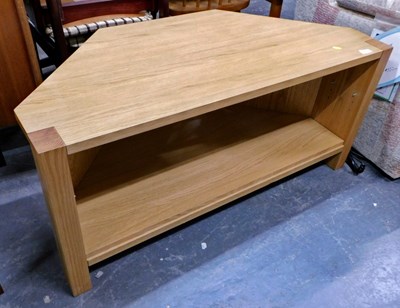 Lot 1506 - A contemporary oak television stand, the base...