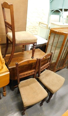Lot 1532 - An oak gate leg table, together with three...