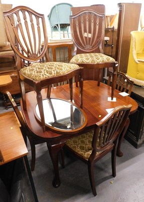 Lot 1557 - A G-Plan dining suite, comprising a circular...