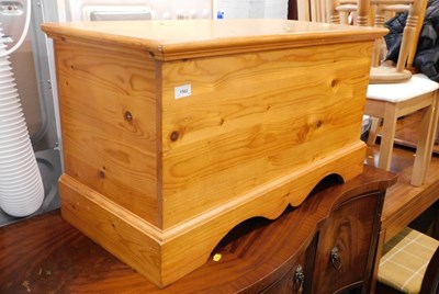 Lot 1562 - A pine blanket box, the hinged lid enclosing a...