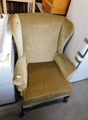Lot 1576 - A green draylon upholstered armchair, raised...