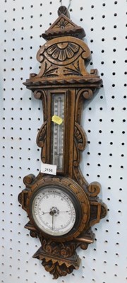 Lot 2156 - A late 20thC oak cased aneroid barometer, 60cm...