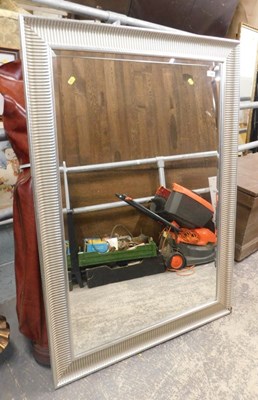 Lot 1608 - A wall mirror, in a silvered frame, 131cm x...