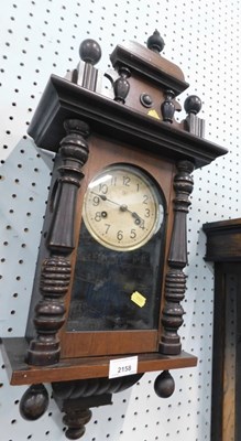 Lot 2158 - A mid 20thC mahogany cased wall clock, with a...