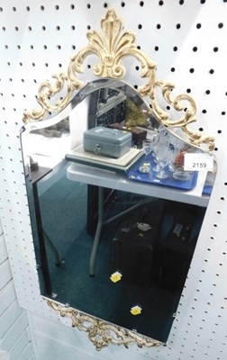 Lot 2159 - A 1950s cream and gilt scroll mirror, 75cm...