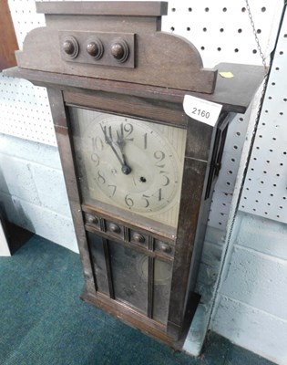 Lot 2160 - A 1950s oak cased wall clock, with silvered...