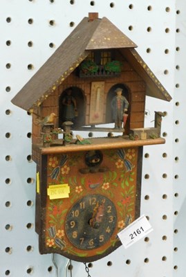 Lot 2161 - A Continental walnut cuckoo clock, with...
