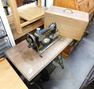 Lot 1638 - A Singer treadle sewing machine.