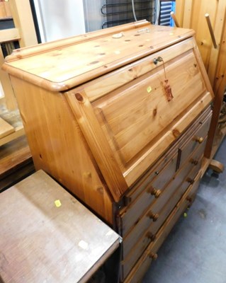 Lot 1639 - A pine bureau, the fall enclosing an...