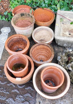 Lot 1660 - A group of terracotta and other plant pots.