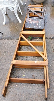 Lot 1669 - A wooden A frame ladder, and another. Note:...