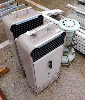 Lot 1670 - A pair of greenhouse heaters, and another.