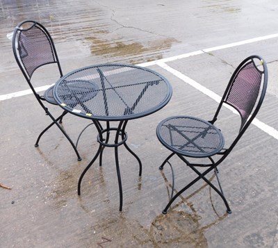 Lot 1673 - A bistro set, in black, comprising table and...