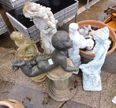 Lot 1675 - A group of garden ornaments, to include an...