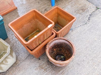 Lot 1677 - Three terracotta square plant pots, and...